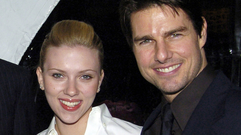 Scarlett Johansson and Tom Cruise smiling