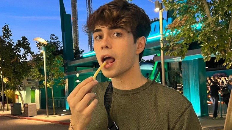 Benji Krol eating a fry