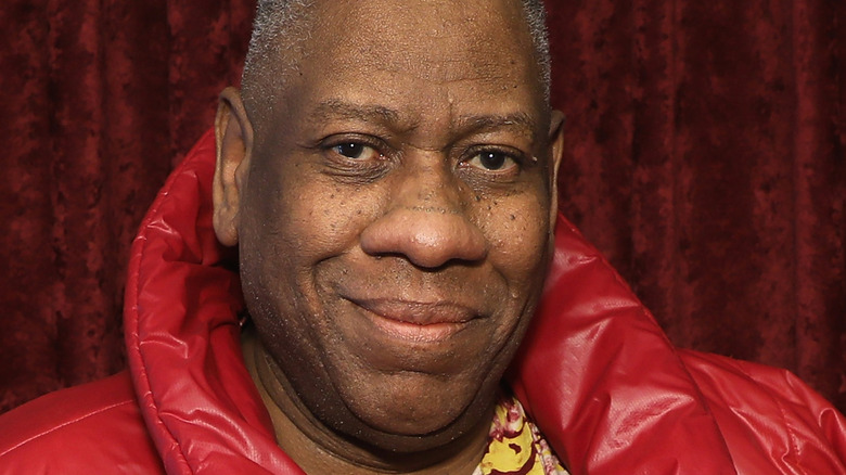 Andre Leon Talley wearing red, smiling