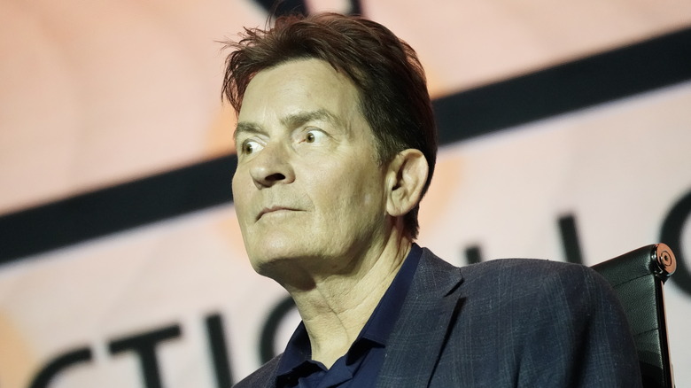 Charlie Sheen looking away, wide-eyed