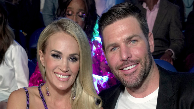 Carrie Underwood and Mike Fisher smiling