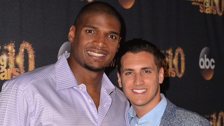 Michael Sam and Vito Cammisano smiling at Dancing with the Stars event