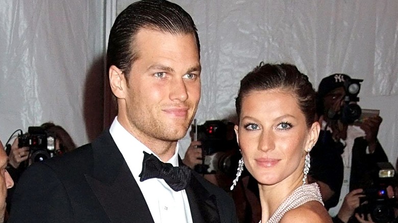 Tom Brady and Gisele Bundchen posing for cameras