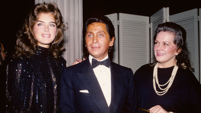 Young Brooke Shields smiling with Valentino and mom Teri Shields