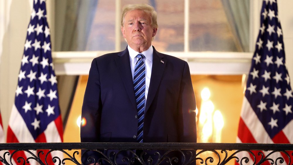 Donald Trump standing on balcony of the White House