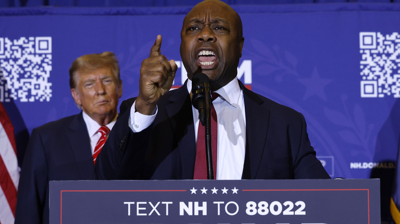 Donald Trump behind Tim Scott speaking