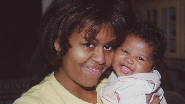 Michelle Obama holds baby Sasha