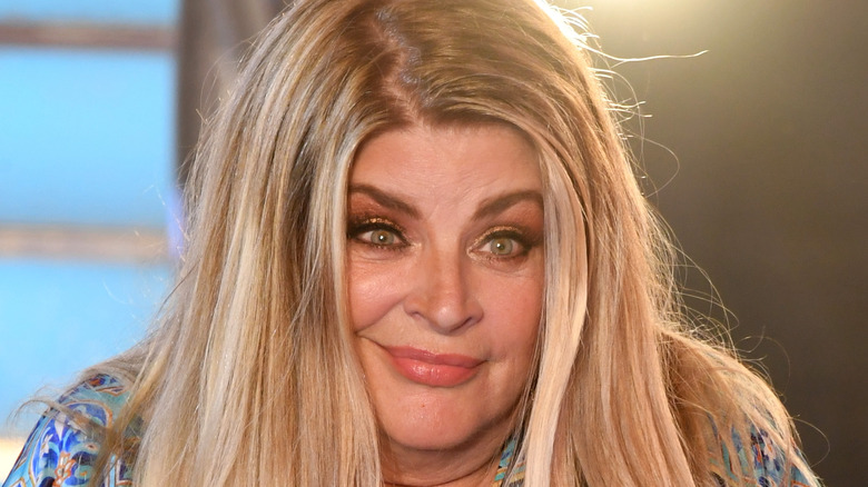 Kristie Alley smirking