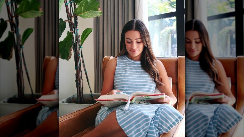 Lea Michele reading a book