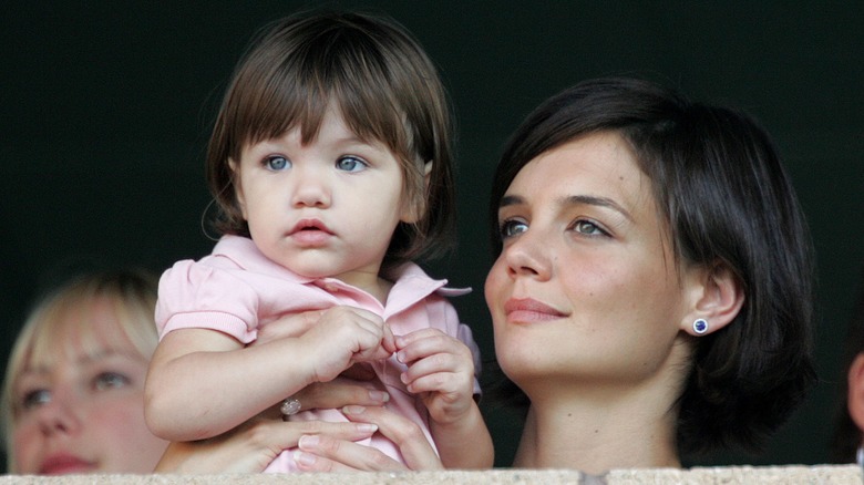 Katie Holmes holding Suri Cruise