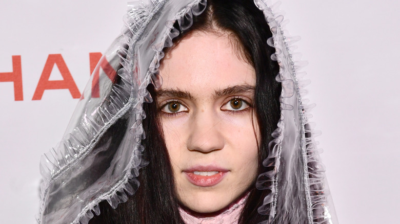 Grimes, wearing Chanel, attends a Chanel Party to celebrate the Chanel Beauty House