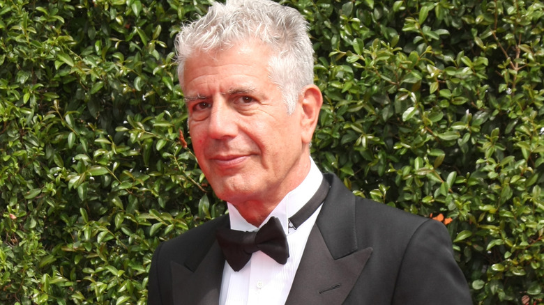 Anthony Bourdain poses in a tux