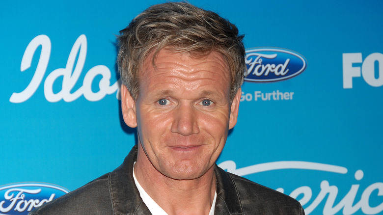 Gordon Ramsay poses in a dark jacket