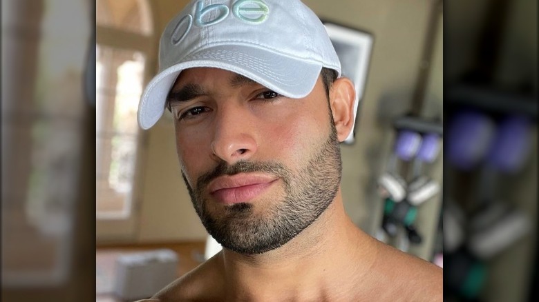 Sam Asghari wearing a hat