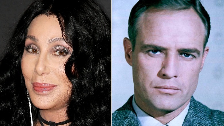 Cher smiling, Marlon Brando staring