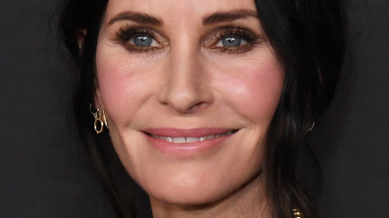 Courteney Cox black hair blue eyes