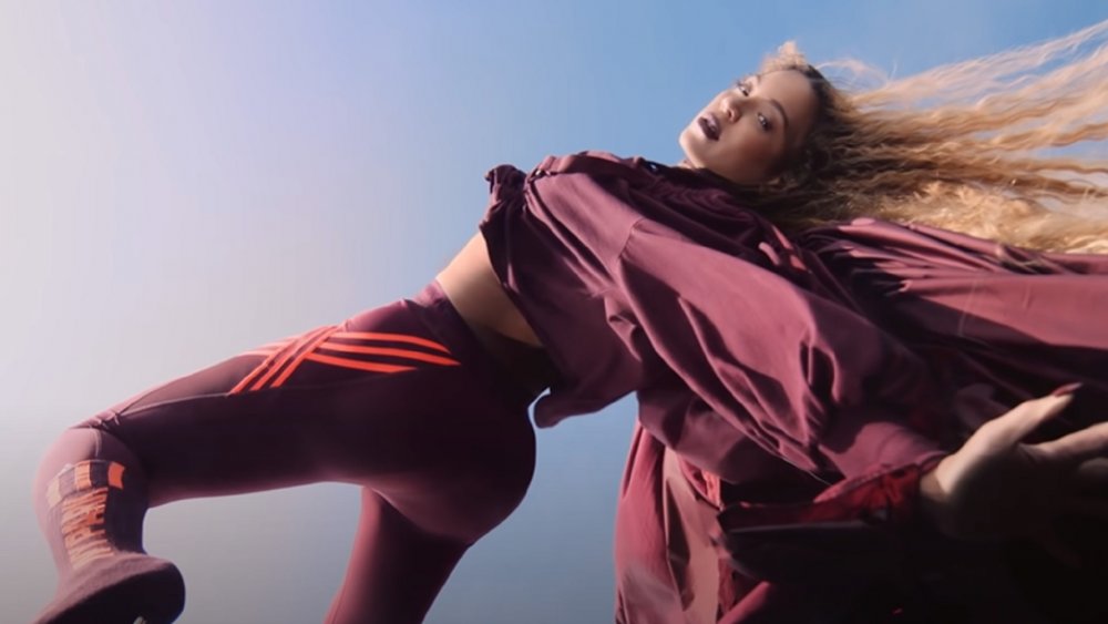 Beyoncé posing in a maroon Ivy Park activewear outfit