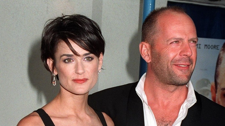 Bruce Willis posing with Demi Moore