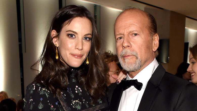 Liv Tyler posing with Bruce Willis