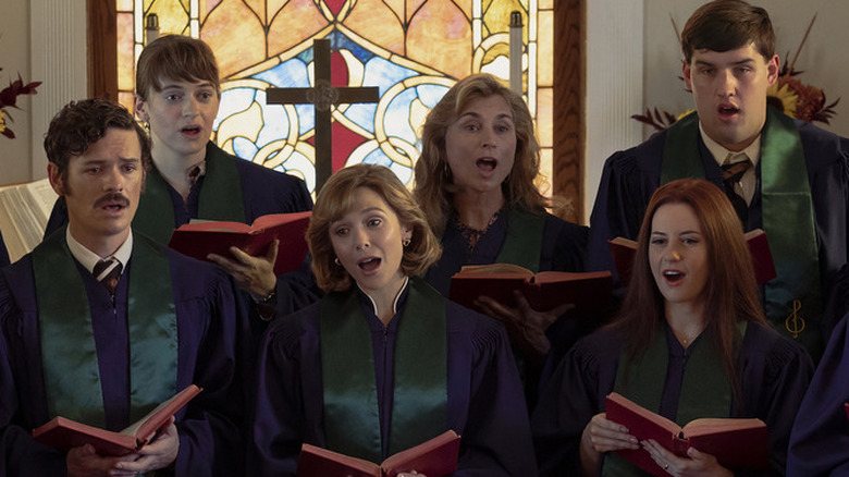 Elizabeth Olsen as Candy Montgomery in Love & Death singing with choir