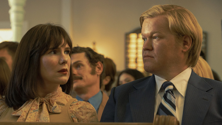 Lily Rabe as Betty Gore and Jesse Plemons as Allan Gore in church looking stern