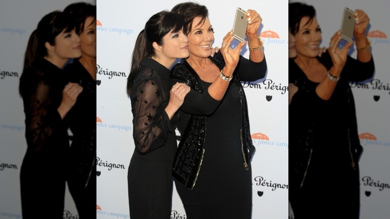 Kris Jenner posing with Selma Blair on the red carpet