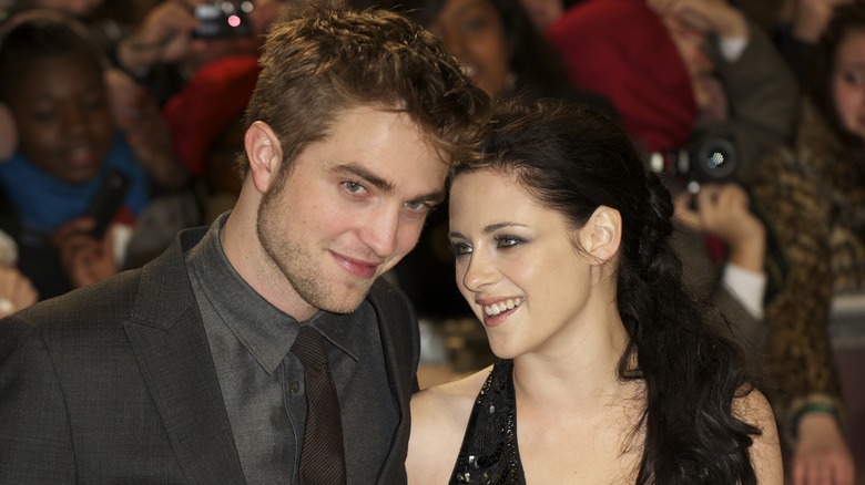 Robert Pattinson and Kristen Stewart smiling