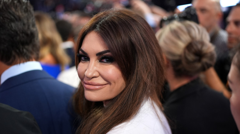 Kimberly Guilfoyle smiling over shoulder