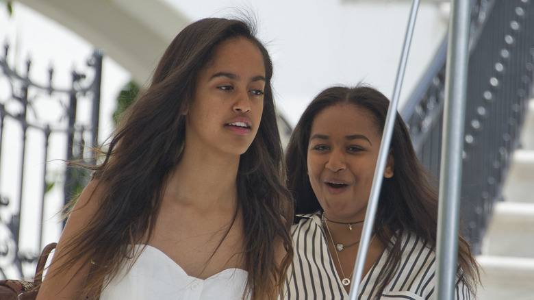 Malia and Sasha Obama walk together