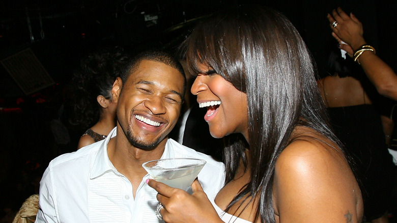 Usher and Tameka Foster laughing