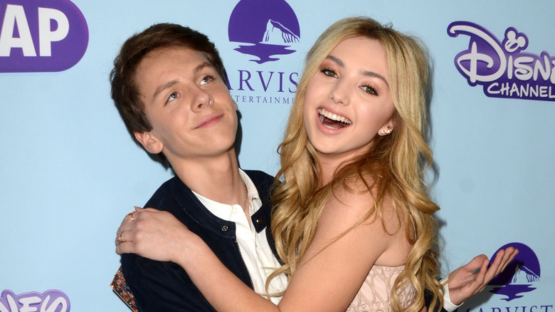 Jacob Bertrand hugging Peyton List