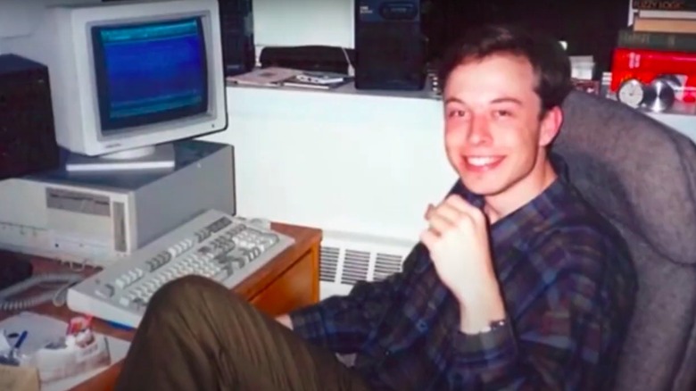 Elon Musk as a young man in front of a computer