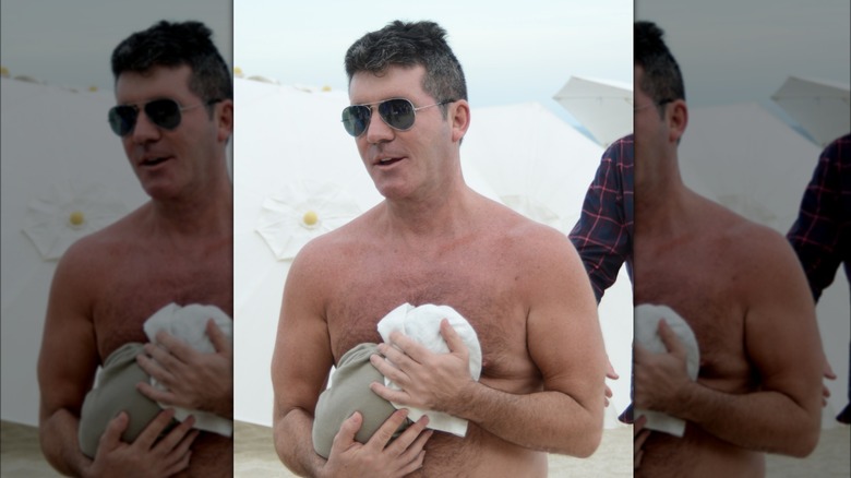 Simon holding Eric Cowell