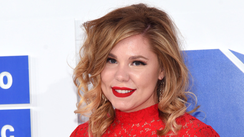 Kailyn Lowry, wearing a red top, smiling