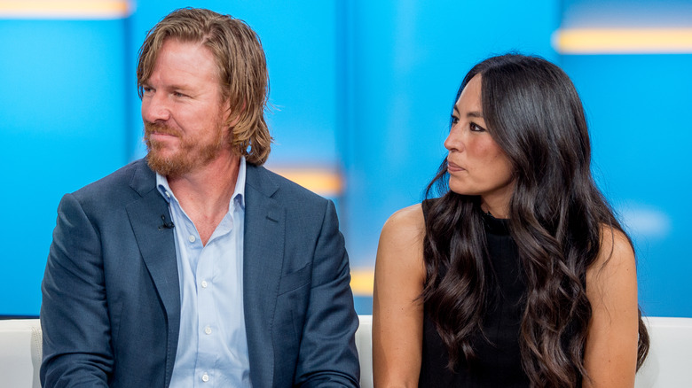 Chip and Joanna Gaines looking sideways