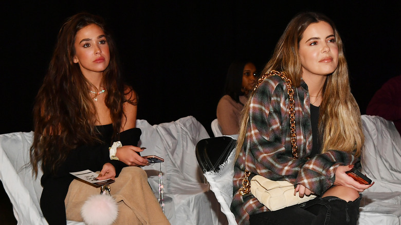 Ariana and Brielle Biermann sit at an event