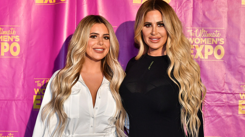 Kim Zolciak and her daughter posing