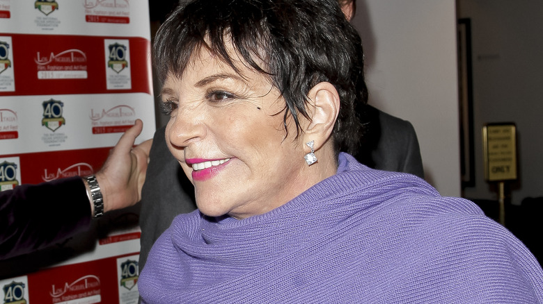 Liza Minnelli smiling and walking