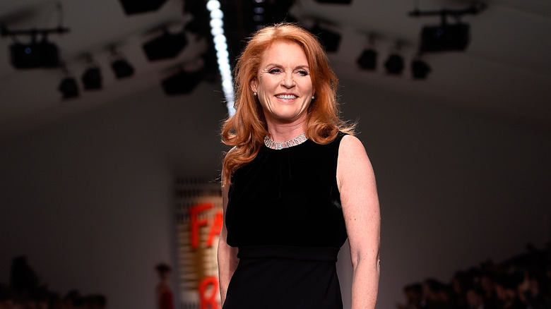 Sarah Ferguson poses in a black dress.