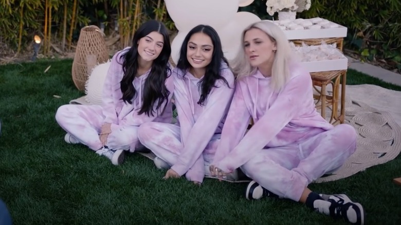 Charli D'Amelio sitting with Avani Gregg and Madi Monroe