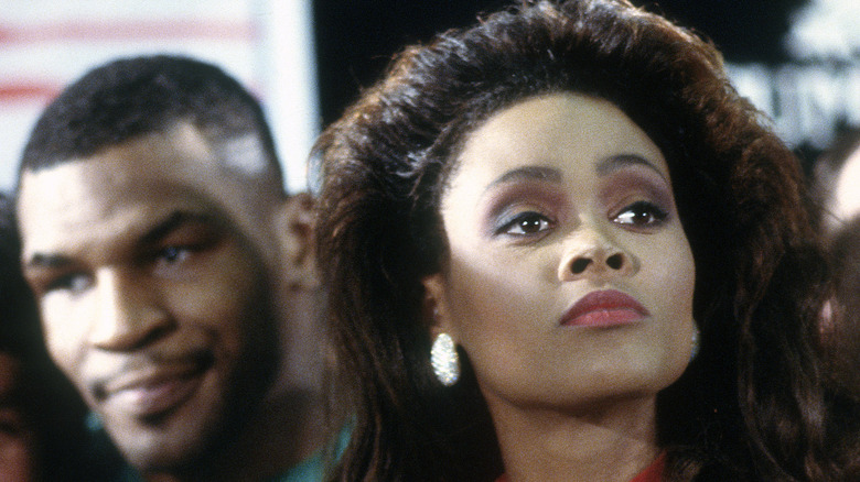 Robin Givens angry and Mike Tyson in the background