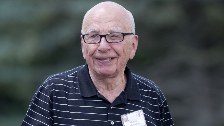 Rupert Murdoch smiling in striped shirt