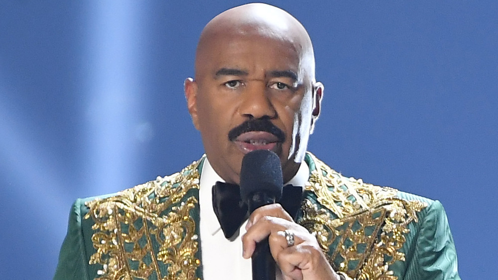 Steve Harvey in a green gold tuxedo