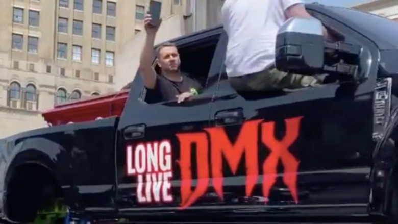 The casket of late rap icon DMX being carried on a "Long Live DMX" monster truck