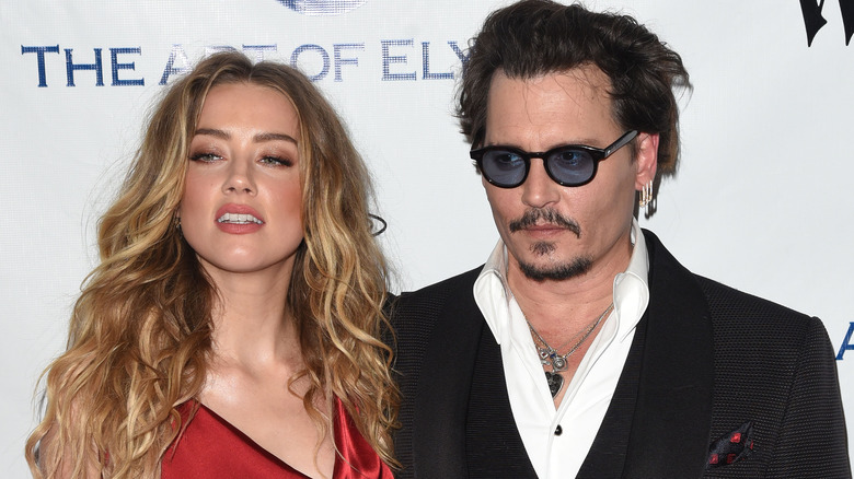 Amber Heard and Johnny Depp posing