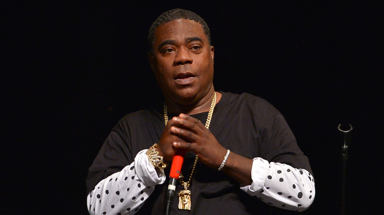 Tracy Morgan holding a mic