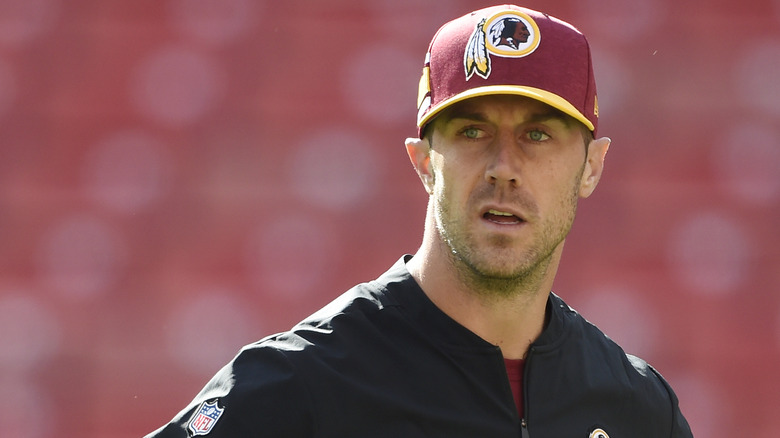 Alex Smith wearing a baseball hat