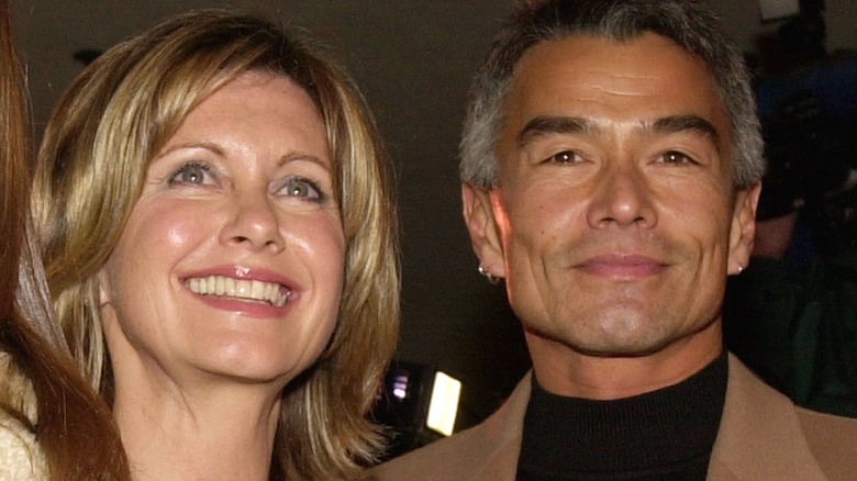 Olivia Newton-John smiling with her boyfriend Patrick McDermott