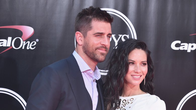 Aaron Rodgers posing with Olivia Munn