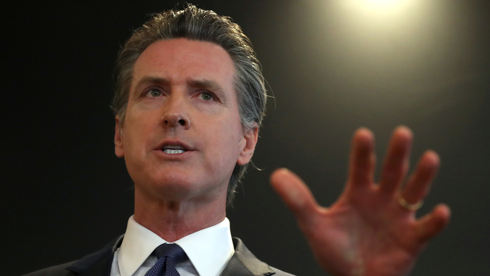 Gavin Newsom waving his hand